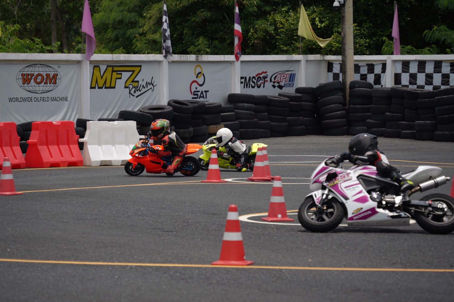 Young EEST NJT rider cornering on track in full racing leathers